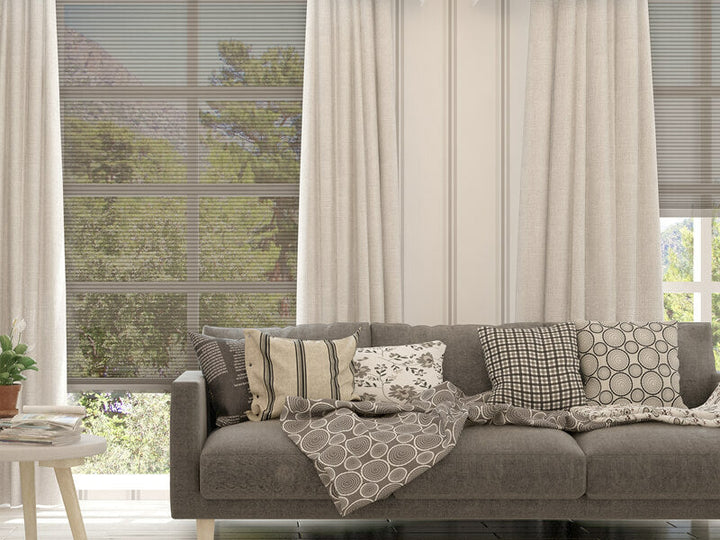 Sheer honeycomb blinds with curtain in lounge room 1